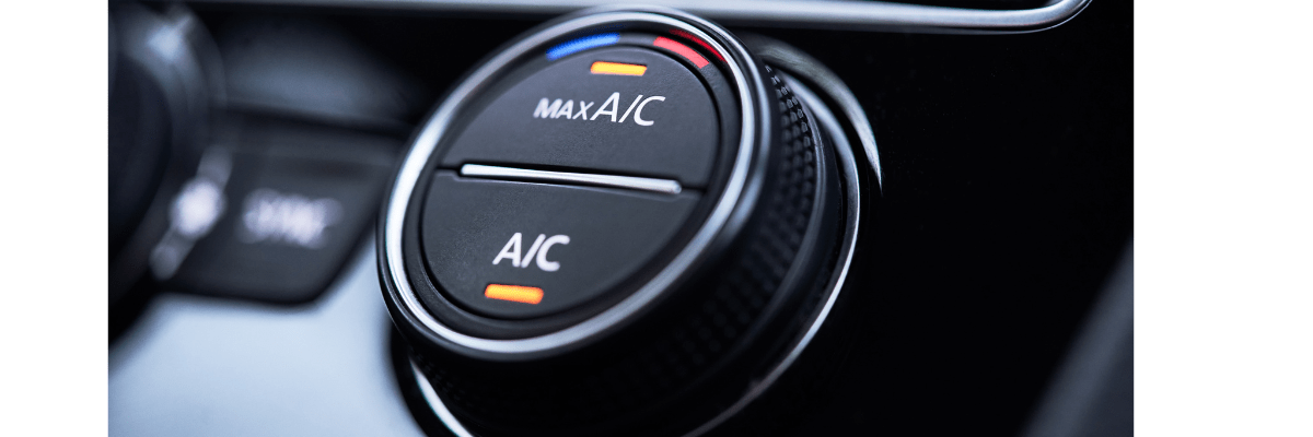 Zoom sur un bouton climatisation dans une voiture